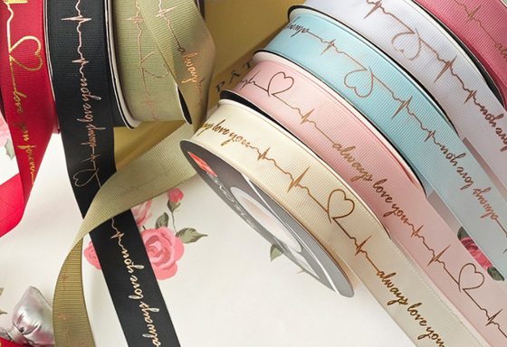 Goede prijs. Xi Hua Spiegelzak Bloem Hartklop Ribbon Bloemenwinkel Bloemenarrangement Warm stempelen Gedrukt lint Valentijnsdag Boeketzak Verpakkingsmaterialen online