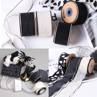 Goede prijs. 100m Hoge vasthoudendheid glanzend Zwart en Wit Sneeuw Border Textiel Gordel DIY Boog Haar Accessoires voor bloemenwinkel Verpakking Gift Box online